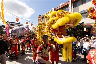 Golden Dragon surrounded by crowd at Cabramatta Moon Festival