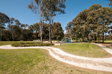 Sign saying Tween Town near footpaths and playground