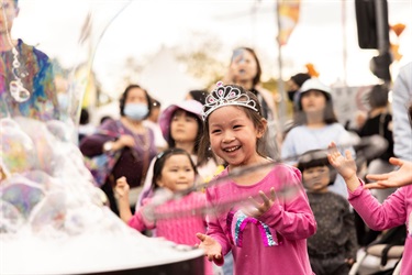 Little-girl-playing-with-bubbles-at-Cabramatta-Moon-Festival-2022.jpg