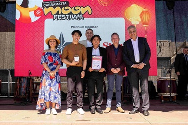 Blue Star Air Conditioning accepting award at Cabramatta Moon Festival 2023