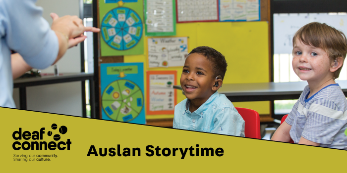 Auslan storytime students, two young boys enjoying a story through sign language