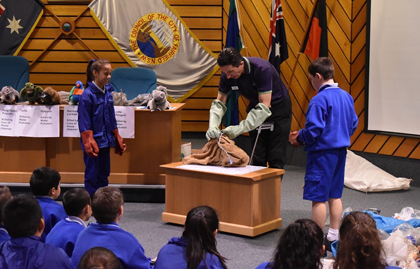 Council staff presenting to students at the Civic Education Program in the Council Chambers