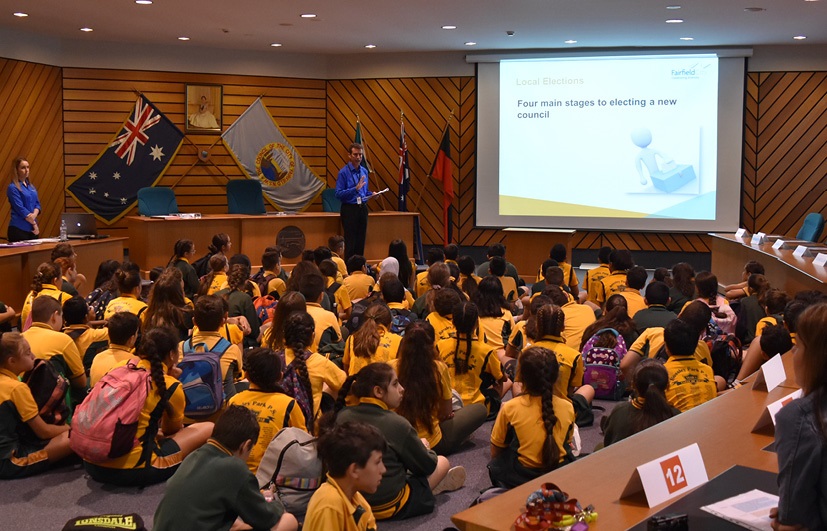 Communications Officer presenting to students at the Civic Education Program