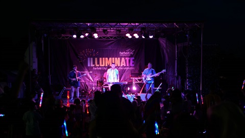Singer C Major performing on a stage at Illuminate event 