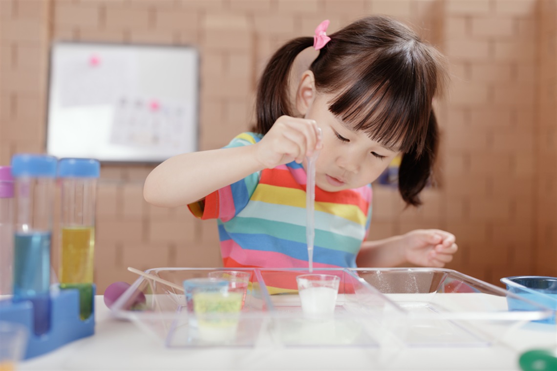 Young girl using a pipette 