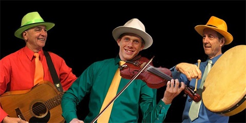 Jazz, pop and contemporary band Tutti Frutti wearing colourful shirts while holding a guitar, violin and flat drum