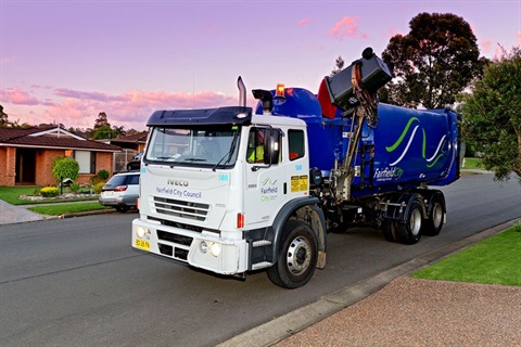 garbage truck emptying bins