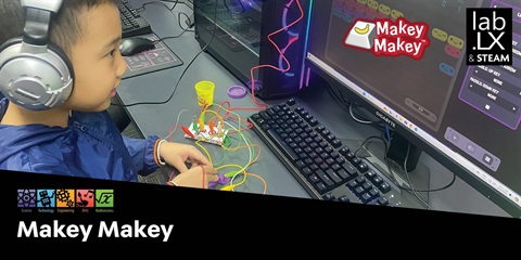 A kid making electrical circuit in a lab.