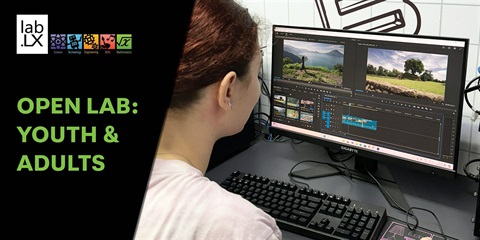 A student sitting in front of a computer.